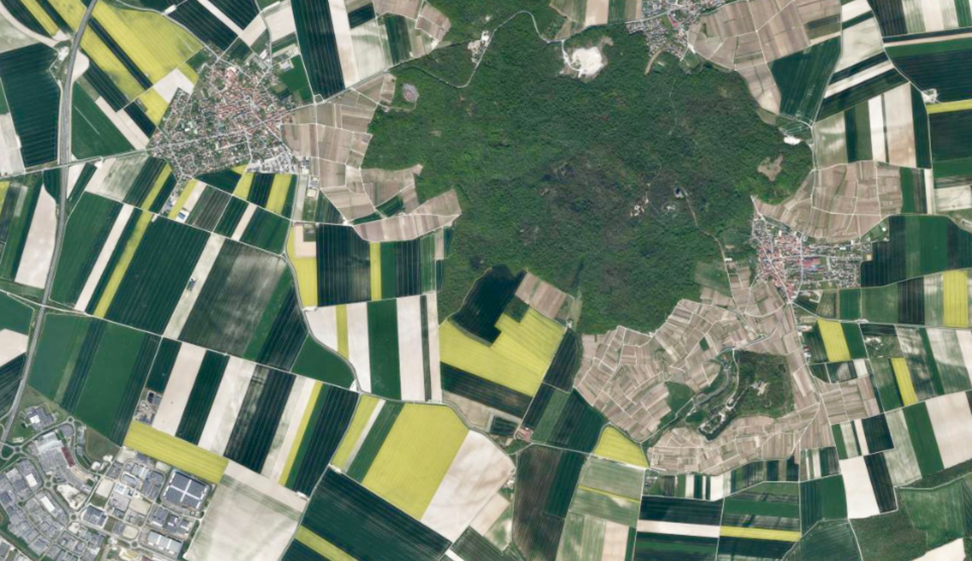 Aerial view of land and forests outside of Reims