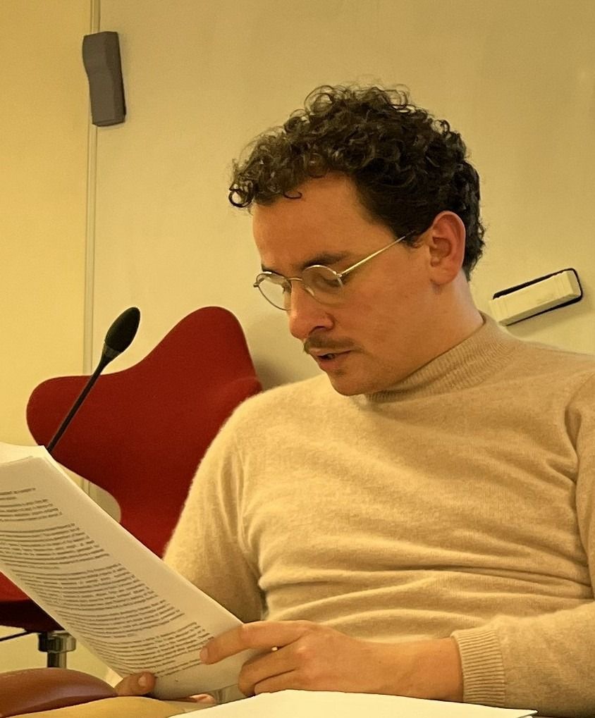 Color photo of Michaël BOURDON with leaves in his hand