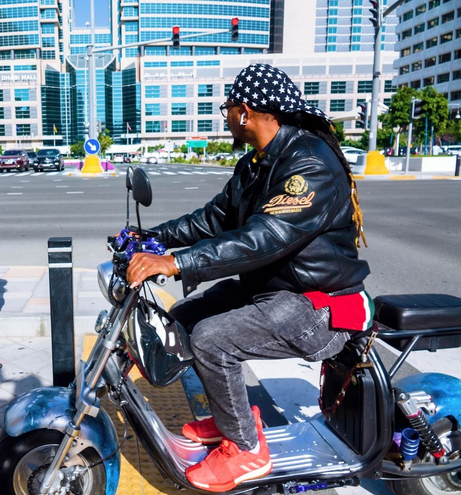 Young man on a motorbike, Abu Dhabi, February 2023.