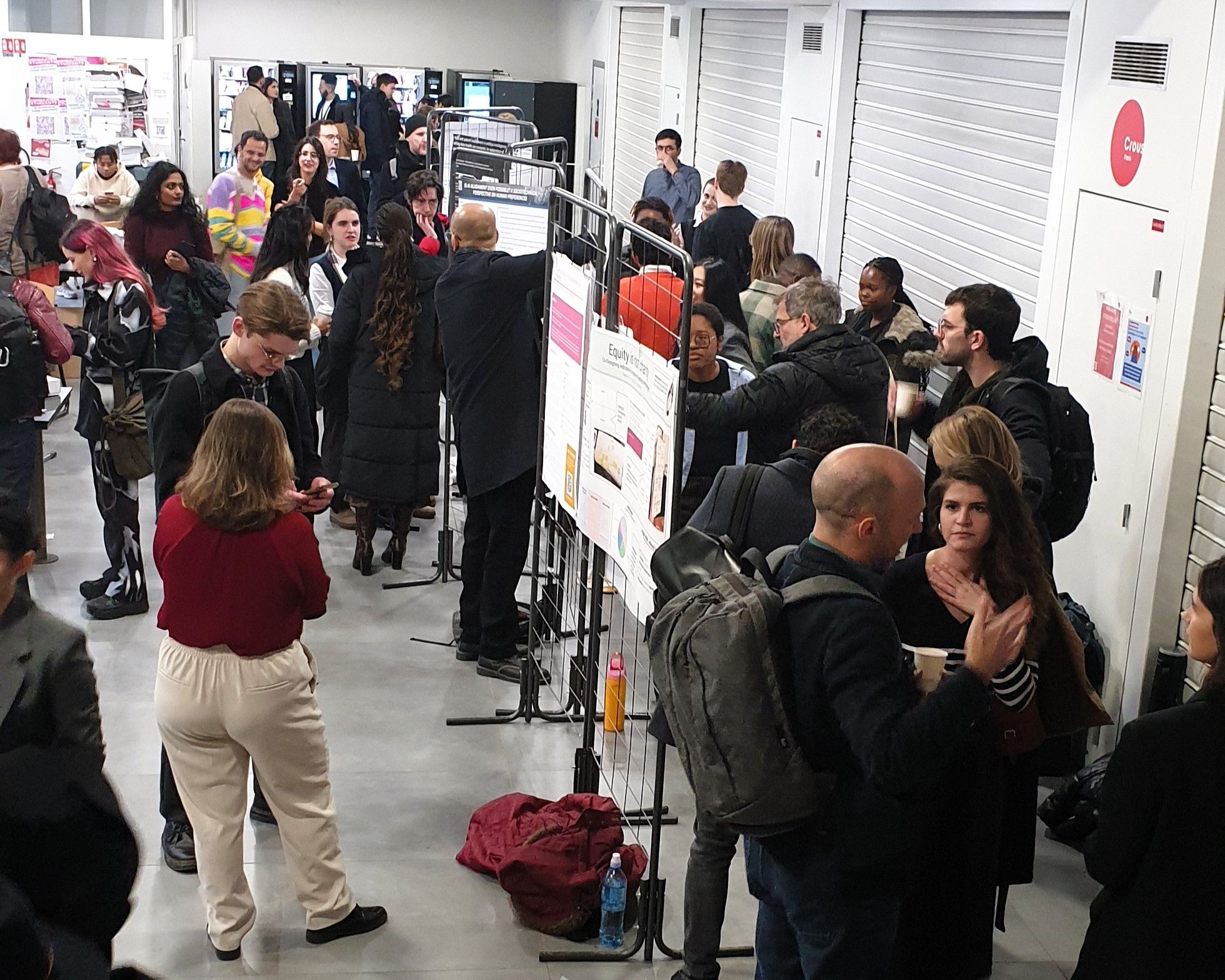 PAIRS participants discussing around the posters