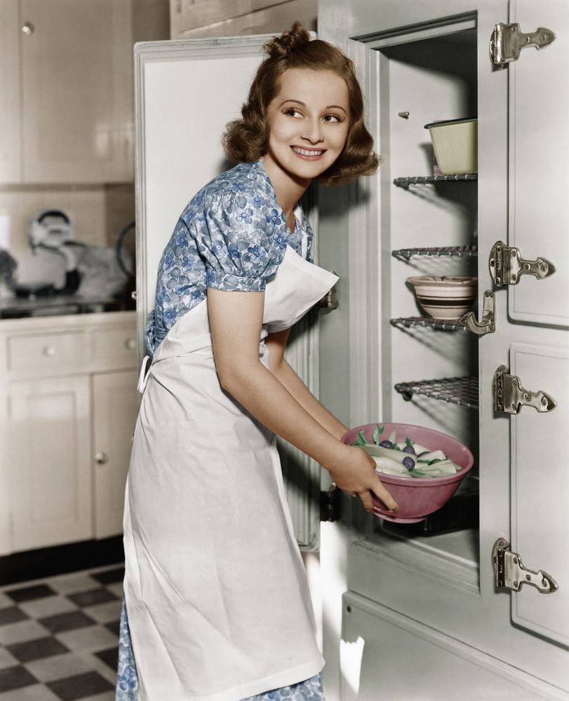 Young woman in kitchen.