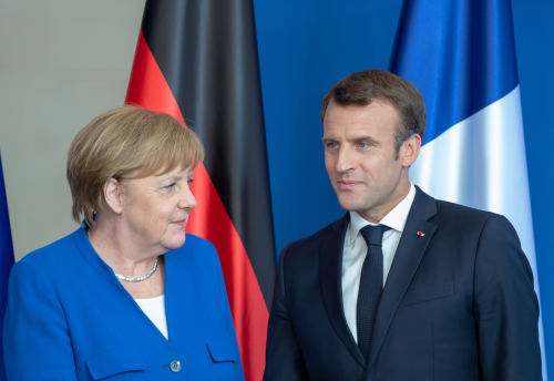 Angela Merkel and Emmanuel Macron. Copyright Shutterstock