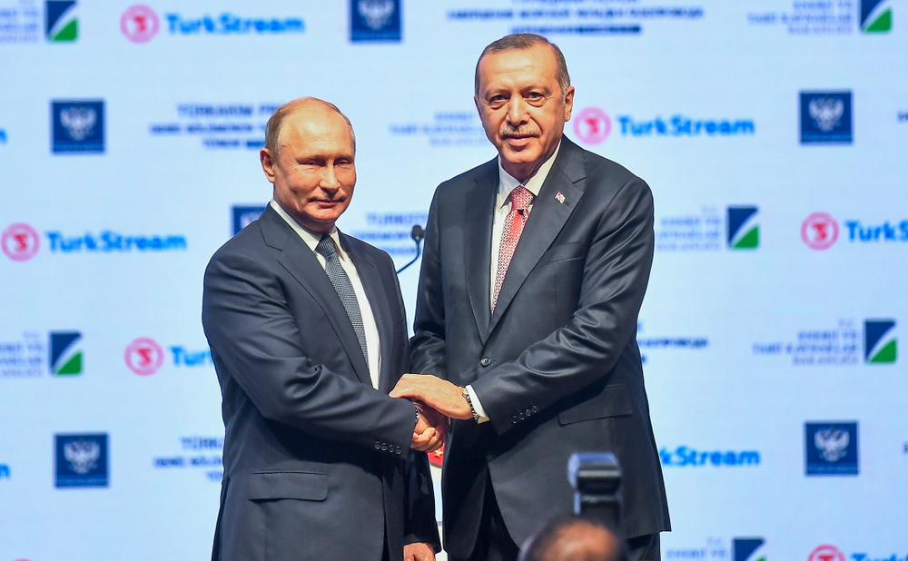 Putin and Erdogan shake hands. Photo by Quetions 123 for Shutterstock