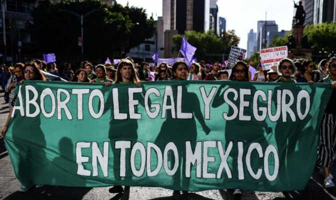 Women in Mexico City carry a banner reading “Legal and safe abortion across Mexi