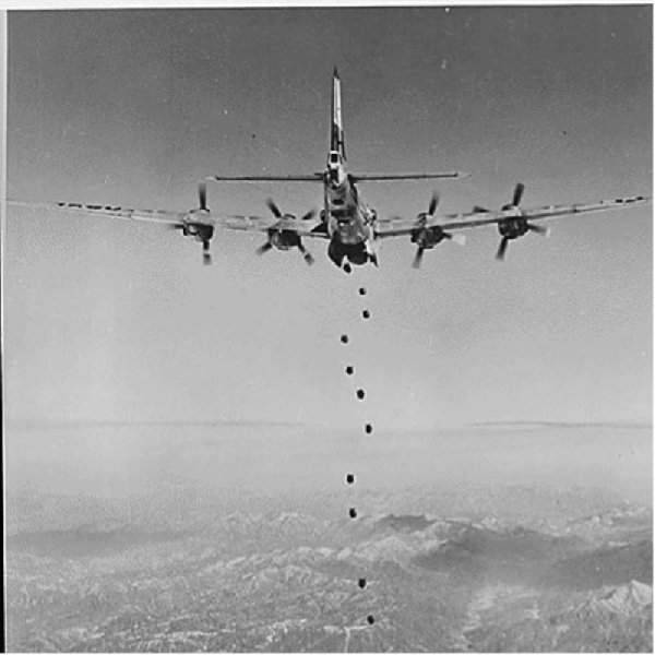 Bombs Away regardless of the type of enemy target lying in this rugged, mountainous terrain of Korea, very little would remain after the falling bombs have done their work. This striking photograph of the lead bomber was made from a B-29 "Superfort" of the Far East Air Forces 19th Bomber Group on the 150th combat mission the 19th Bomber Group had flown since the start of the Korean war, ca. 02/1951