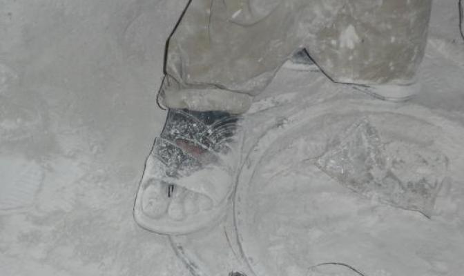 Gemstone worker’s foot, covered in silica dust