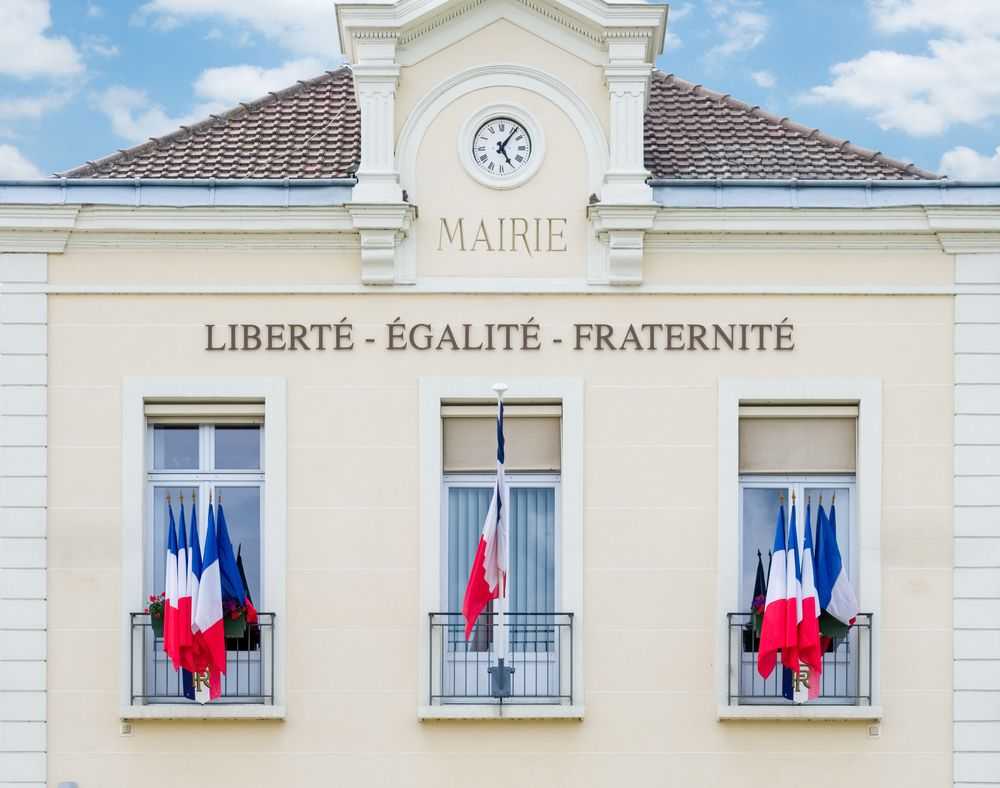 Town hall facade with French flags