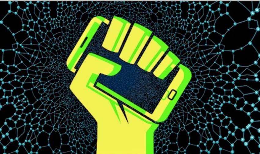 Stylised yellow fist clenching smartphone on vectorial background @ISTOCK/OXINOX