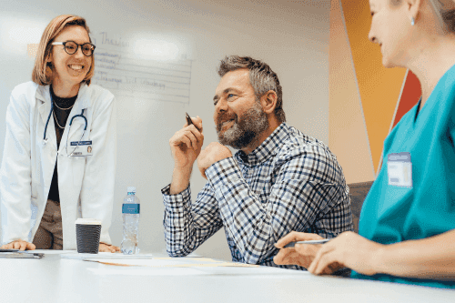 Photo of a doctor, a nurse, and a representative