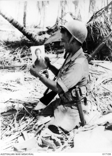 Private Sam Miller of Pennsylvania holds a photograph of a Japanese woman, found in a Japanese dugout when US forces landed on Wakde Island. Photographer: Jim Fitzpatrick, 26 May 1944 https://www.awm.gov.au/collection/C239703