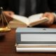 Folder on lawyer table, closeup, Africa Studio, Shutterstock