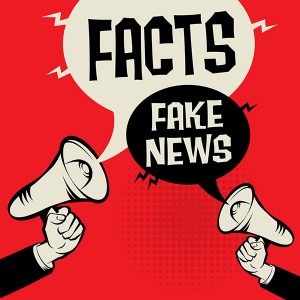 Megaphone Hand business concept with text Facts versus Fake News. Crédits : Astudio, Shutterstock